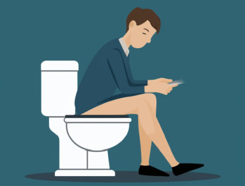 person sitting on the toilet
