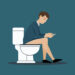 person sitting on the toilet